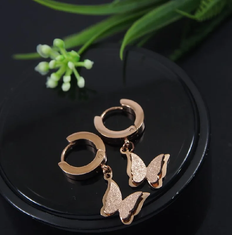 women modern earrings -Tarohi Jewels Stainless Steel Rosegold Plated Butterfly Hoops Earring- STNER 4046