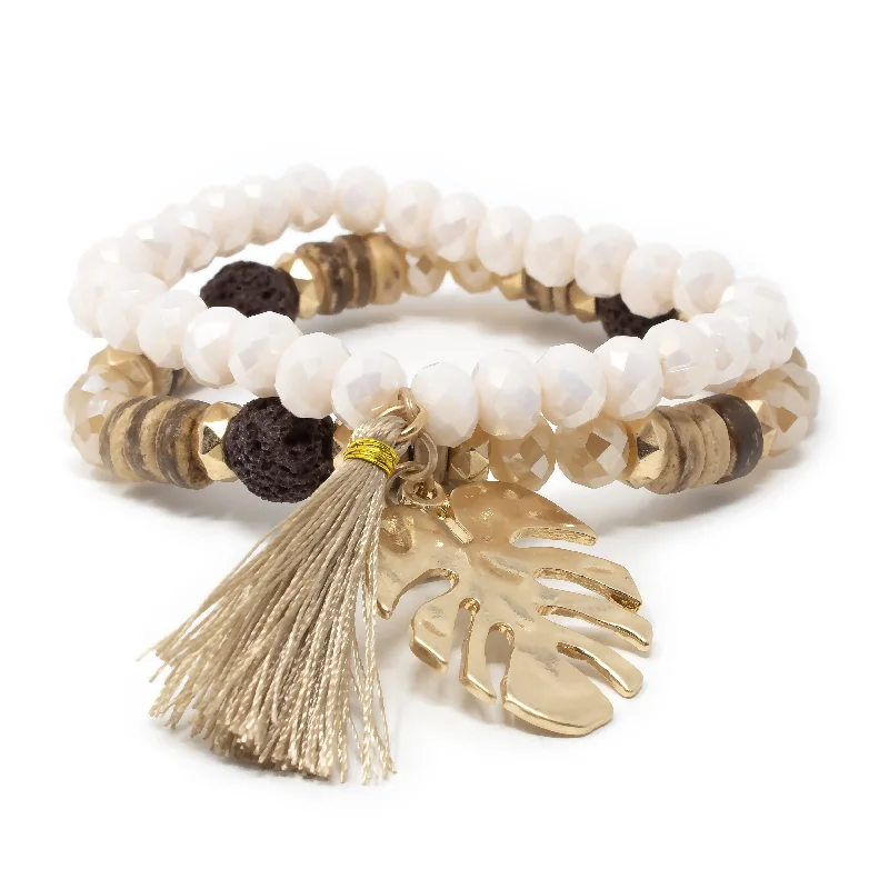 women hammered bangles -Gold Tone Set of Two Stretch Bracelets With Tassel and Leaf Charm Cream